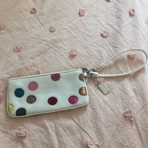 White with multicolored polka dots Coach wristlet